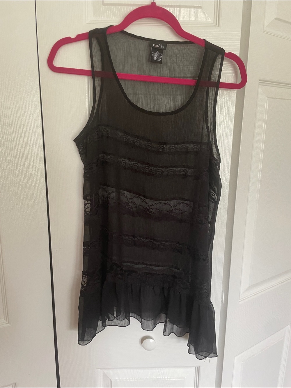 Black lace tank top size L. 4” ruffle around hemline. 28” long